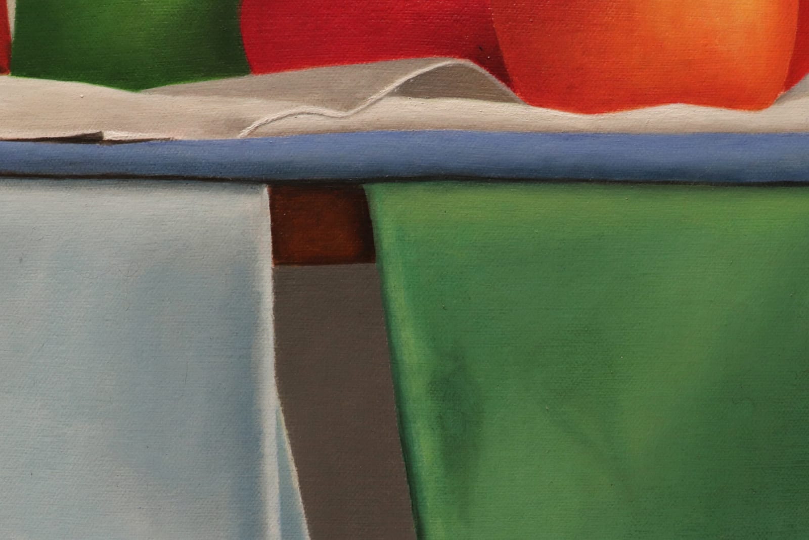 Kettles, bowls, and apples organized on blue green and yellow cloths