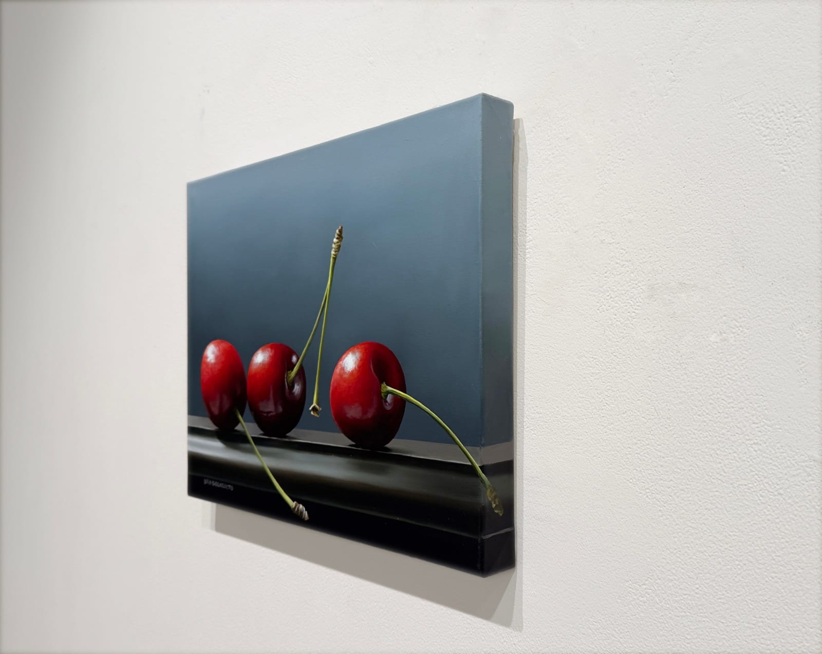 Painting of three cherries