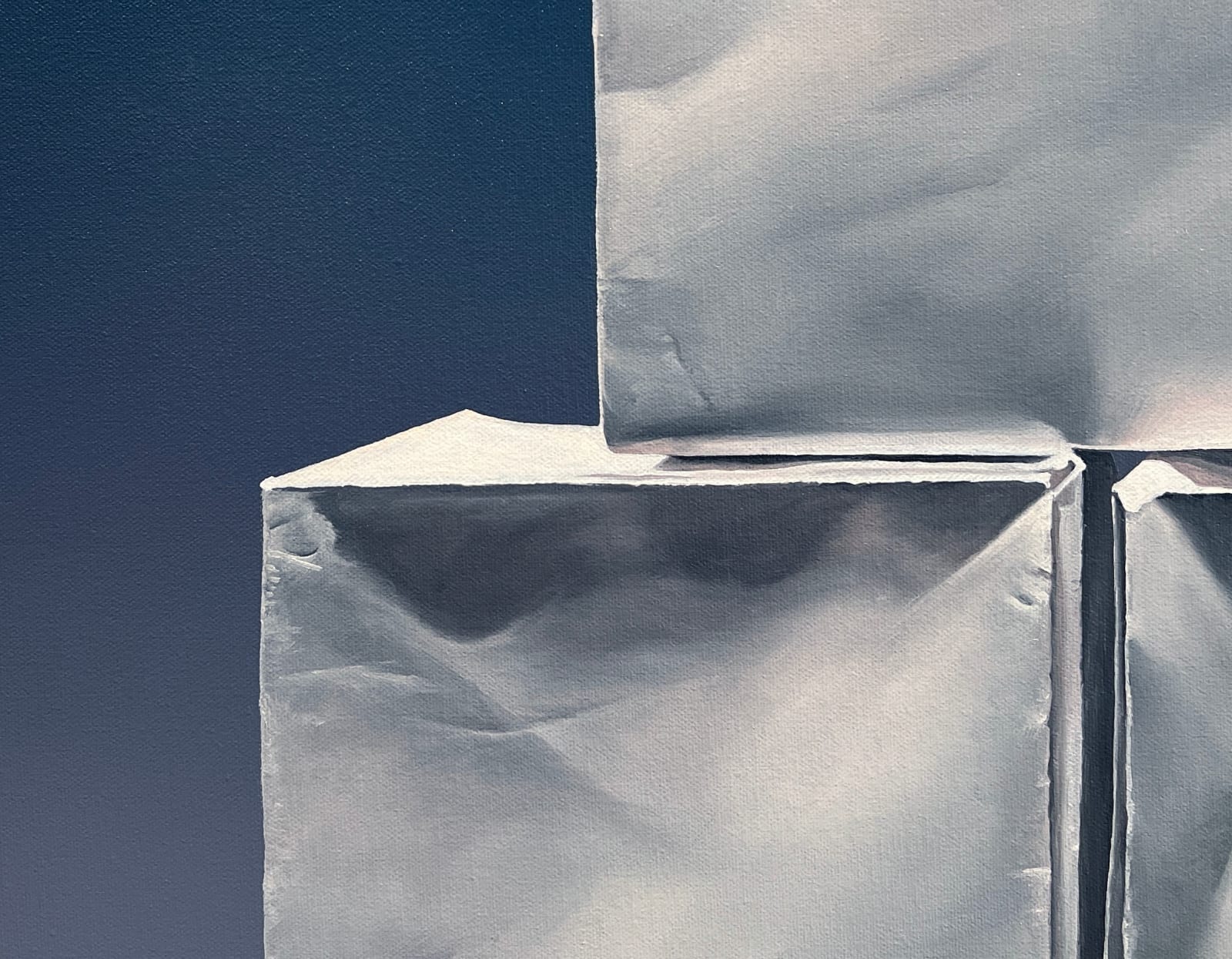 Left side detail of Pyramid of origami paper boxes before dark blue background