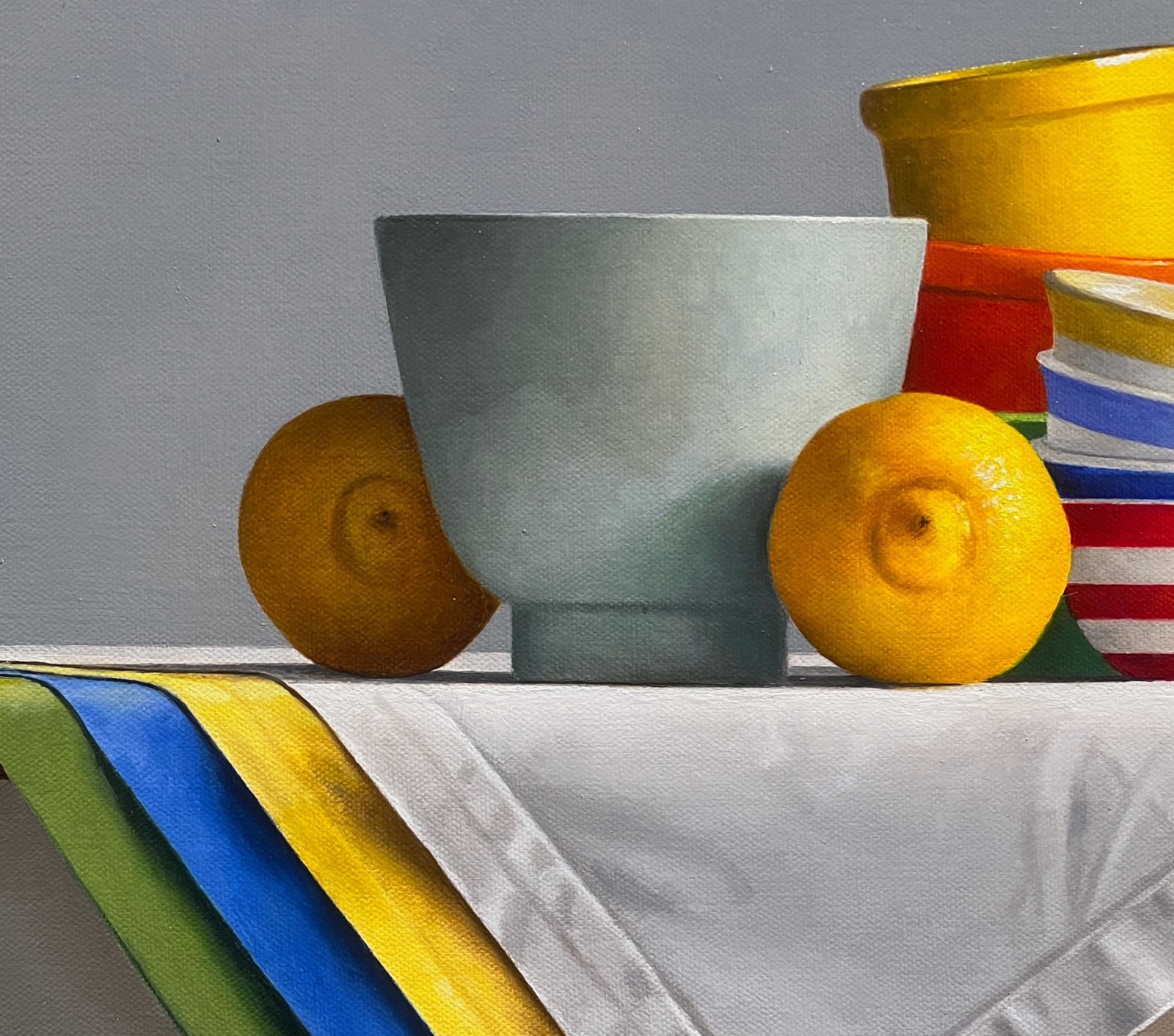 Detail of Lemons with light green bowl, stack of striped bowls, and small bowls