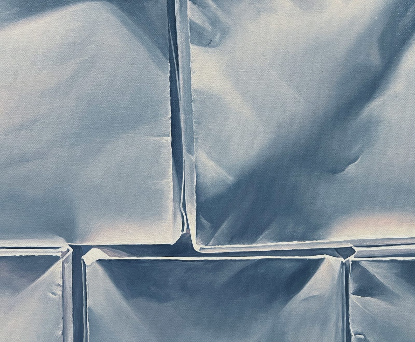 Central detail of Pyramid of origami paper boxes before dark blue background