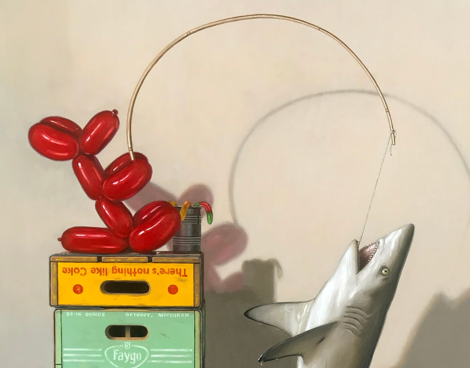 Detail of balloon dog pulling shark on line
