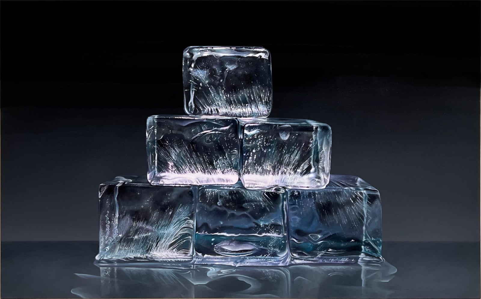 Ice cubes stacked in a pyramid with black background