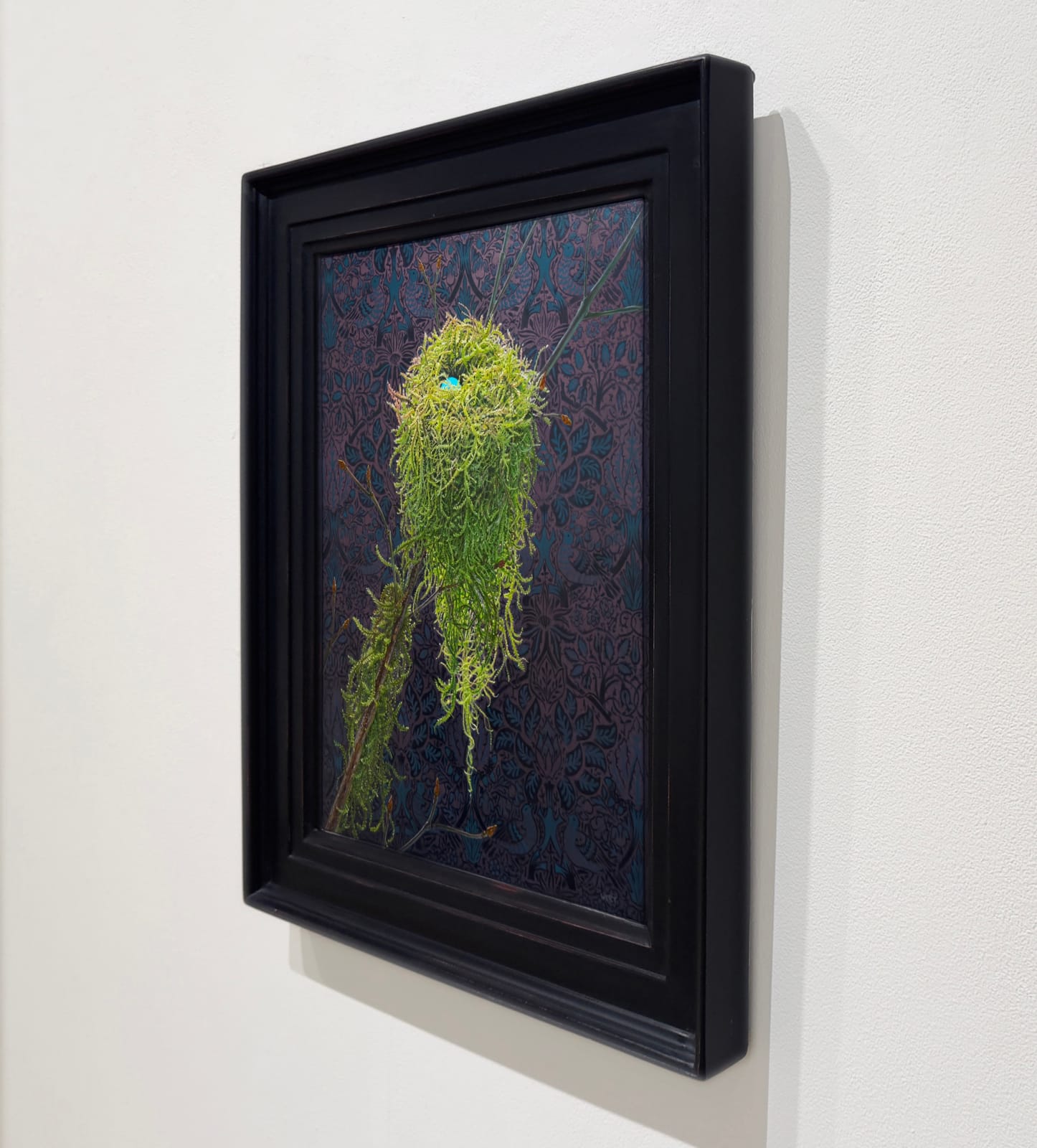 Painting of a moss nest with blue egg in it