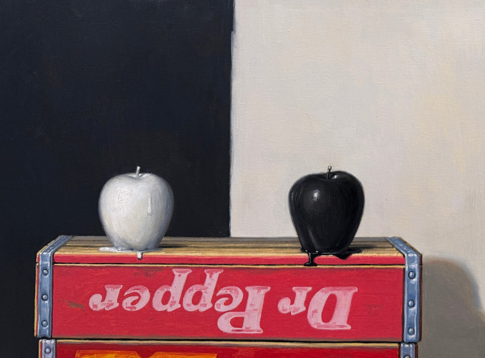 Still life painting of two painted apples on soda boxes