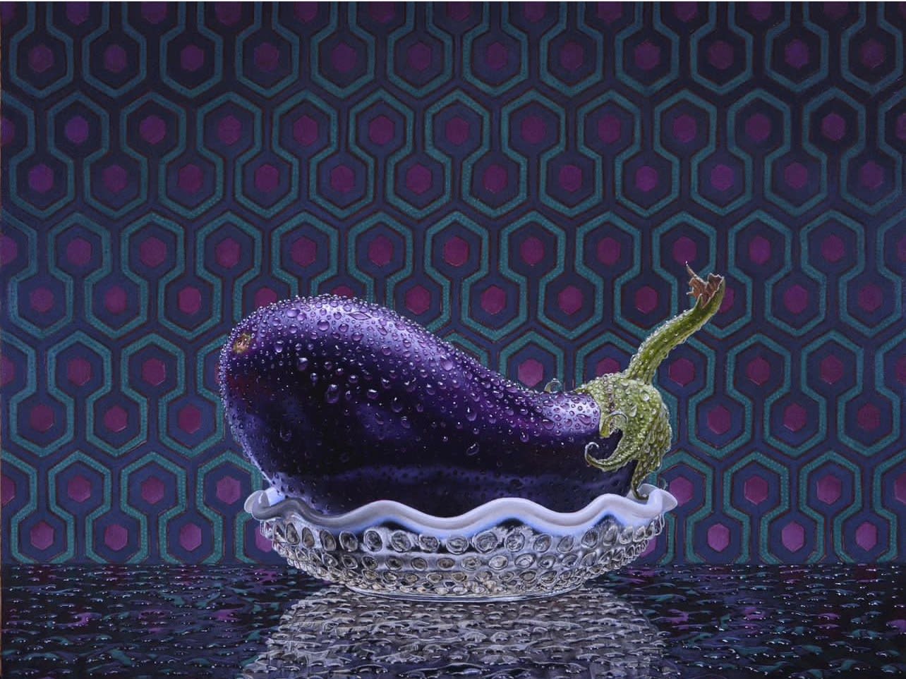 Still life of an eggplant in a glass bowl with a tiled background