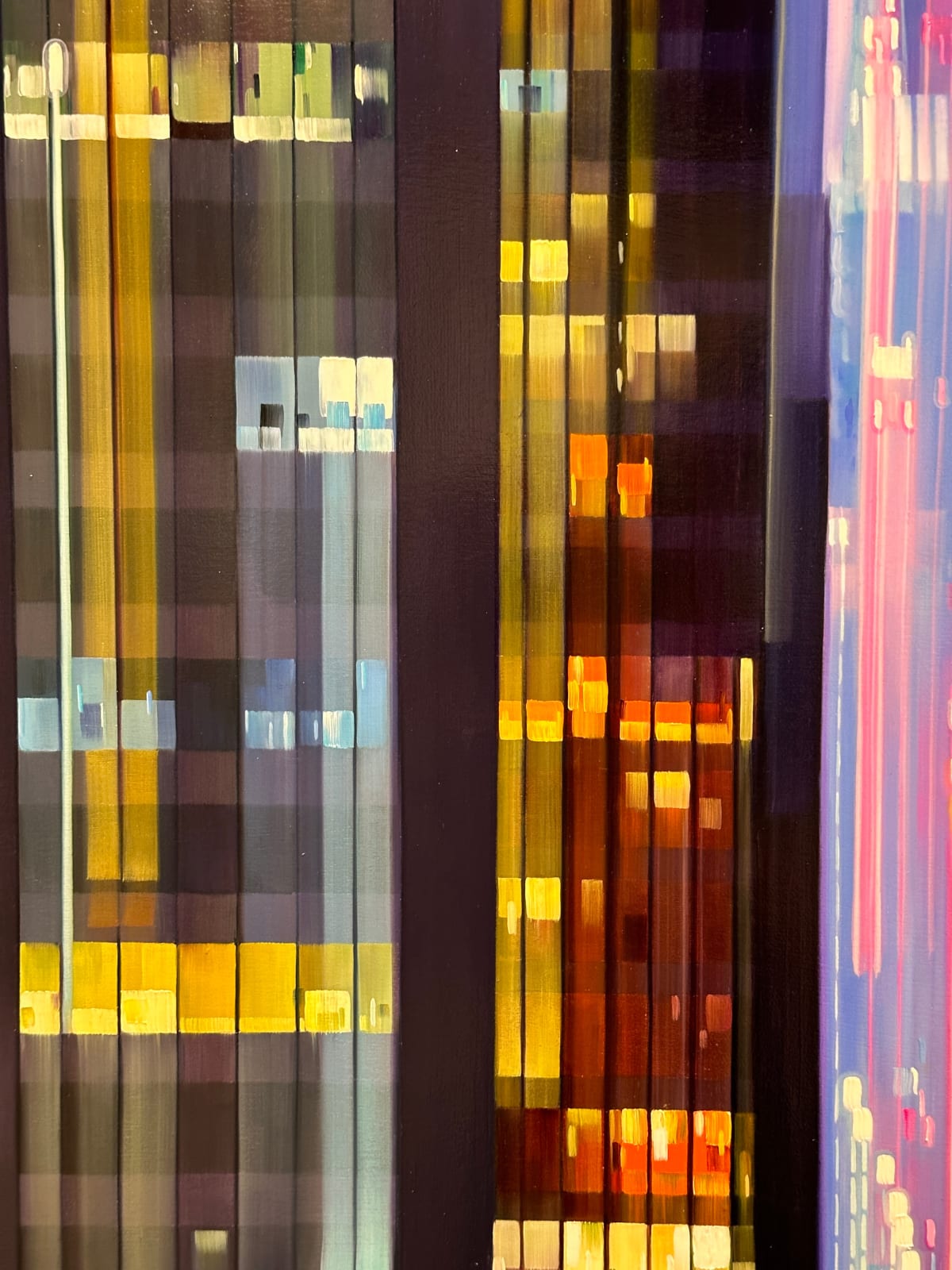 Painting of colorful streaks in between two skyscrapers