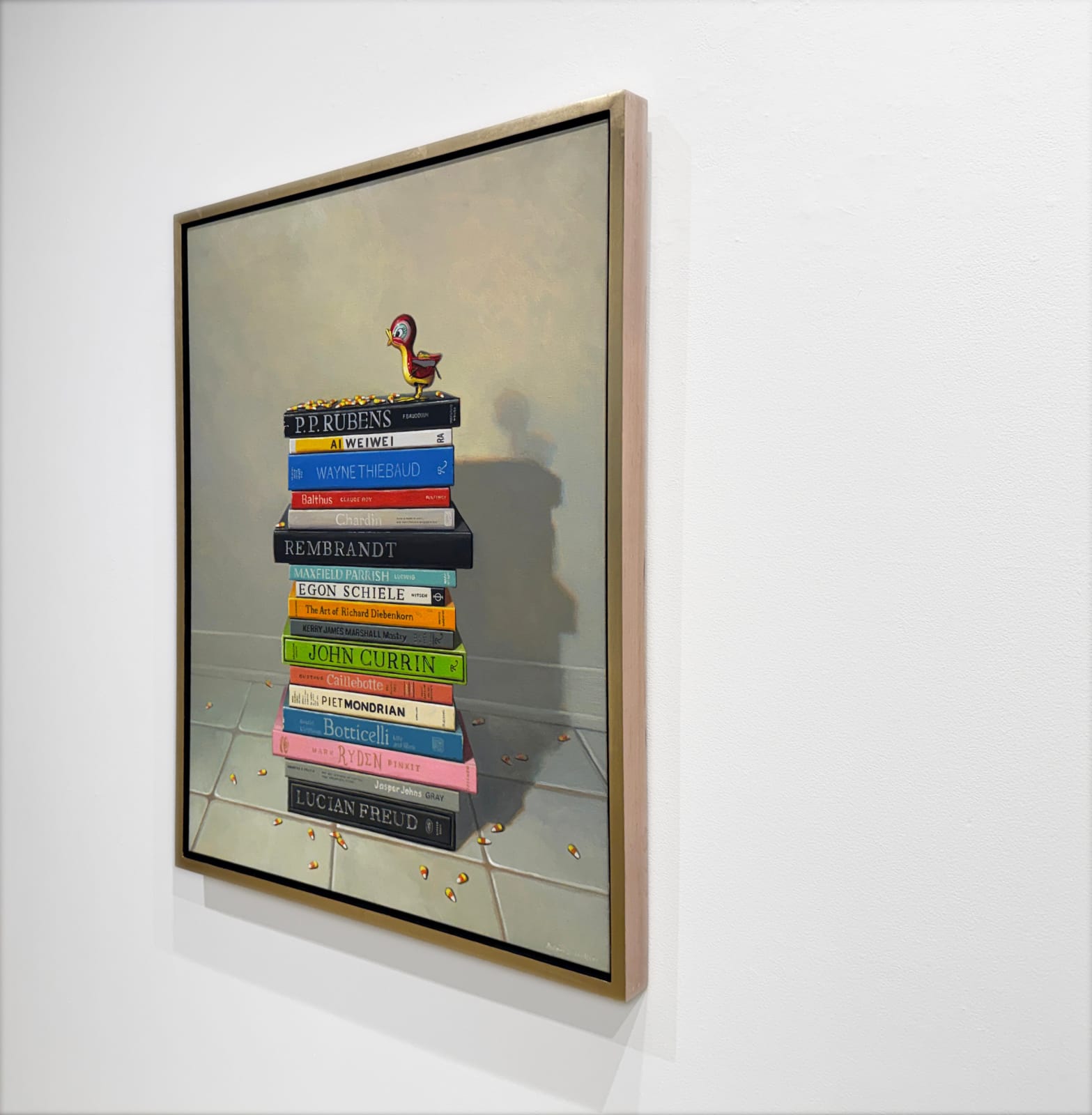 Still life painting of a stack of books with a toy bird atop