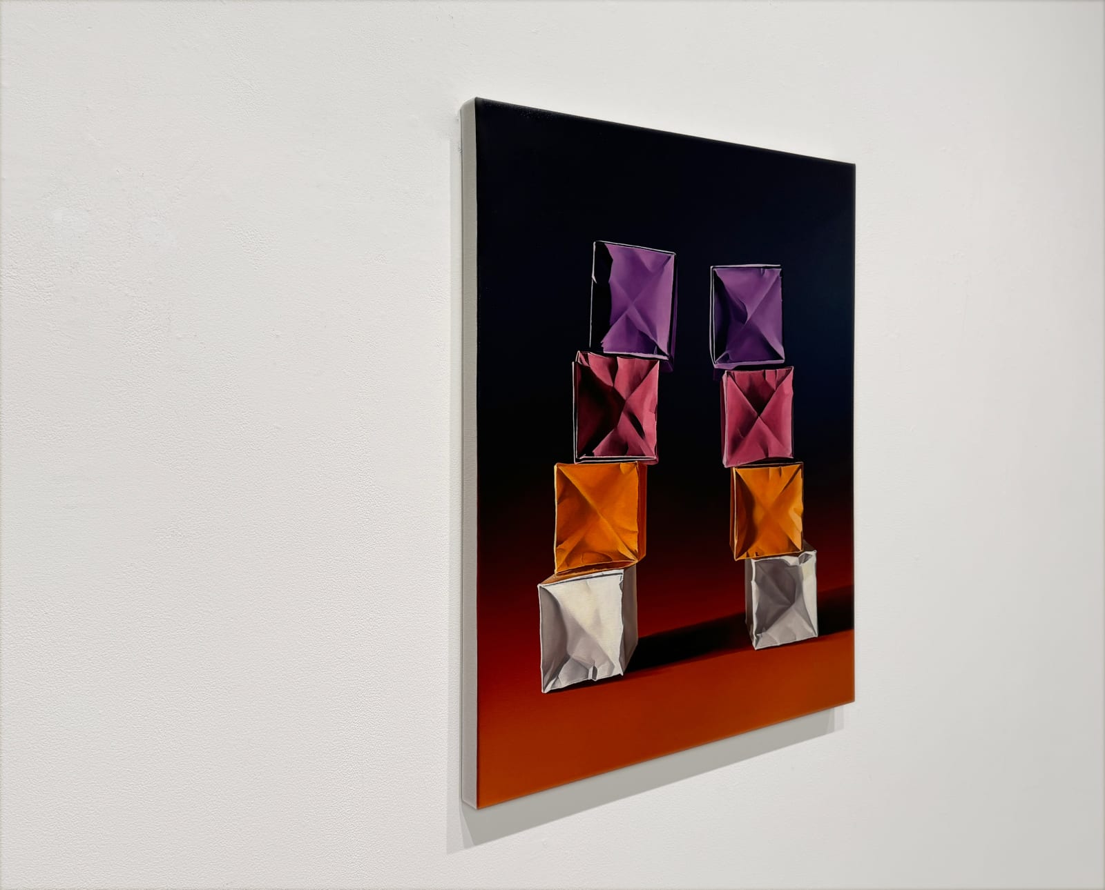 Paper boxes in two stacks on a purple to orange gradient