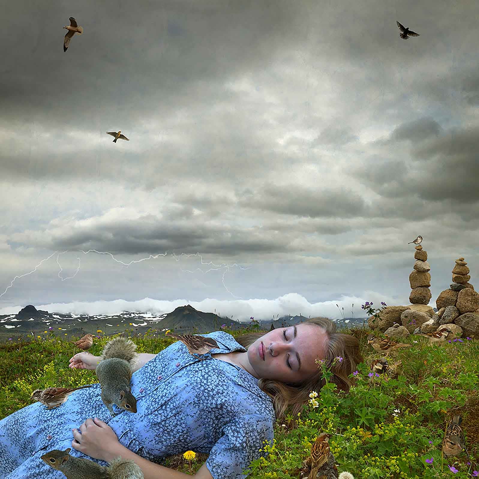 Heat lightening photography Tom Chambers girl laying in Icelandic field buy here Gilman Contemporary Sun Valley art gallery