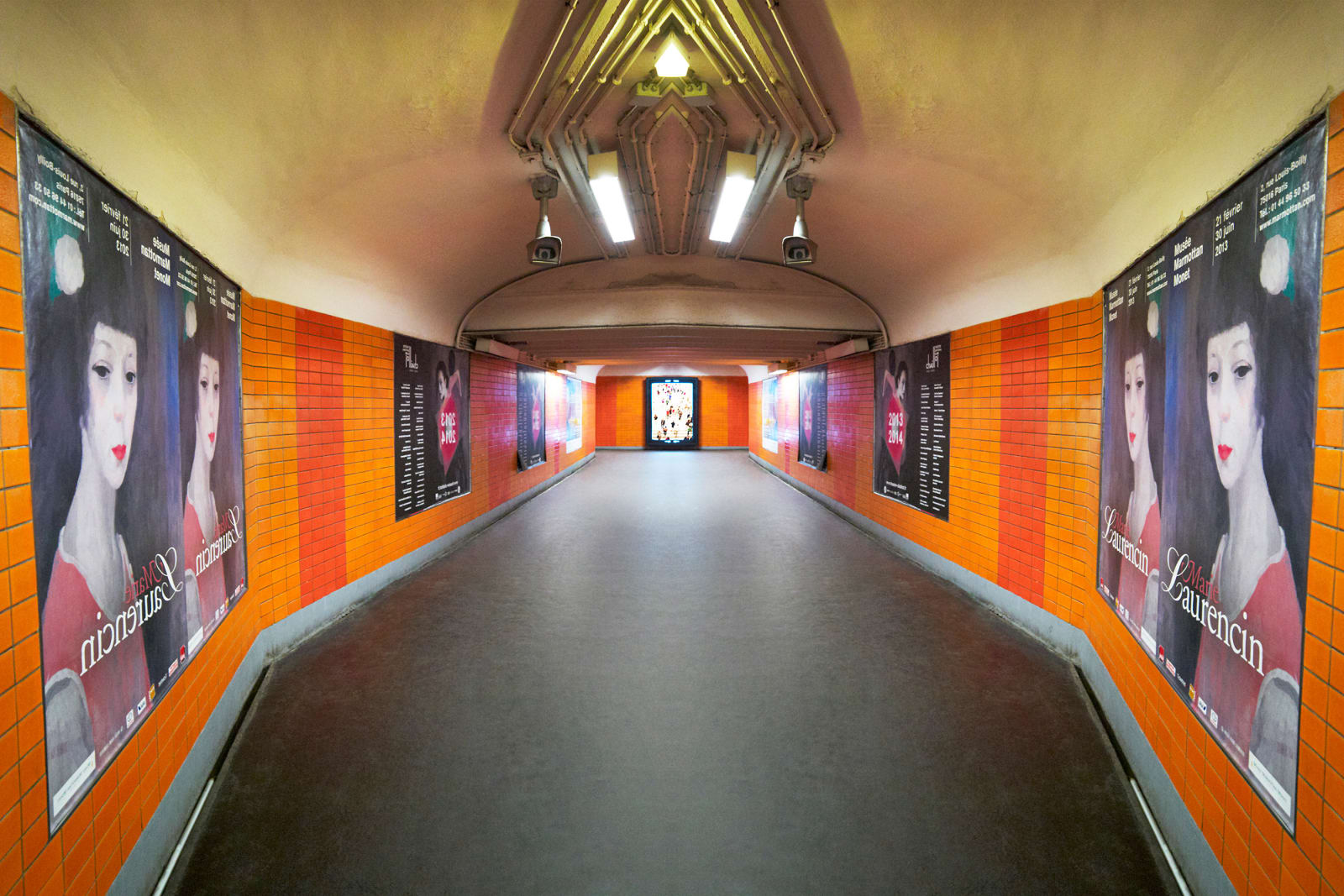 orange tiled metro with posters mirror photo by Laurie Victor Kay