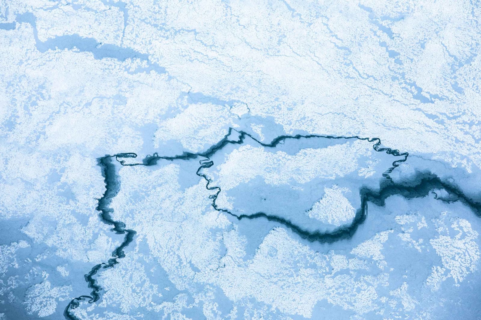 Frozen Jackson Hole lake in winter photograph Tuck Fauntleroy buy here Sun Valley contemporary art Gilman gallery