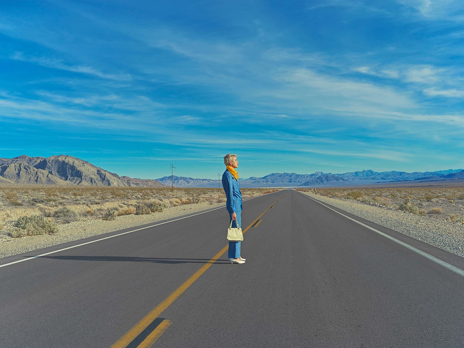 woman standing in empty street Death Valley Maria Svarbova photography buy here now Gilman Contemporary Sun Valley art gallery