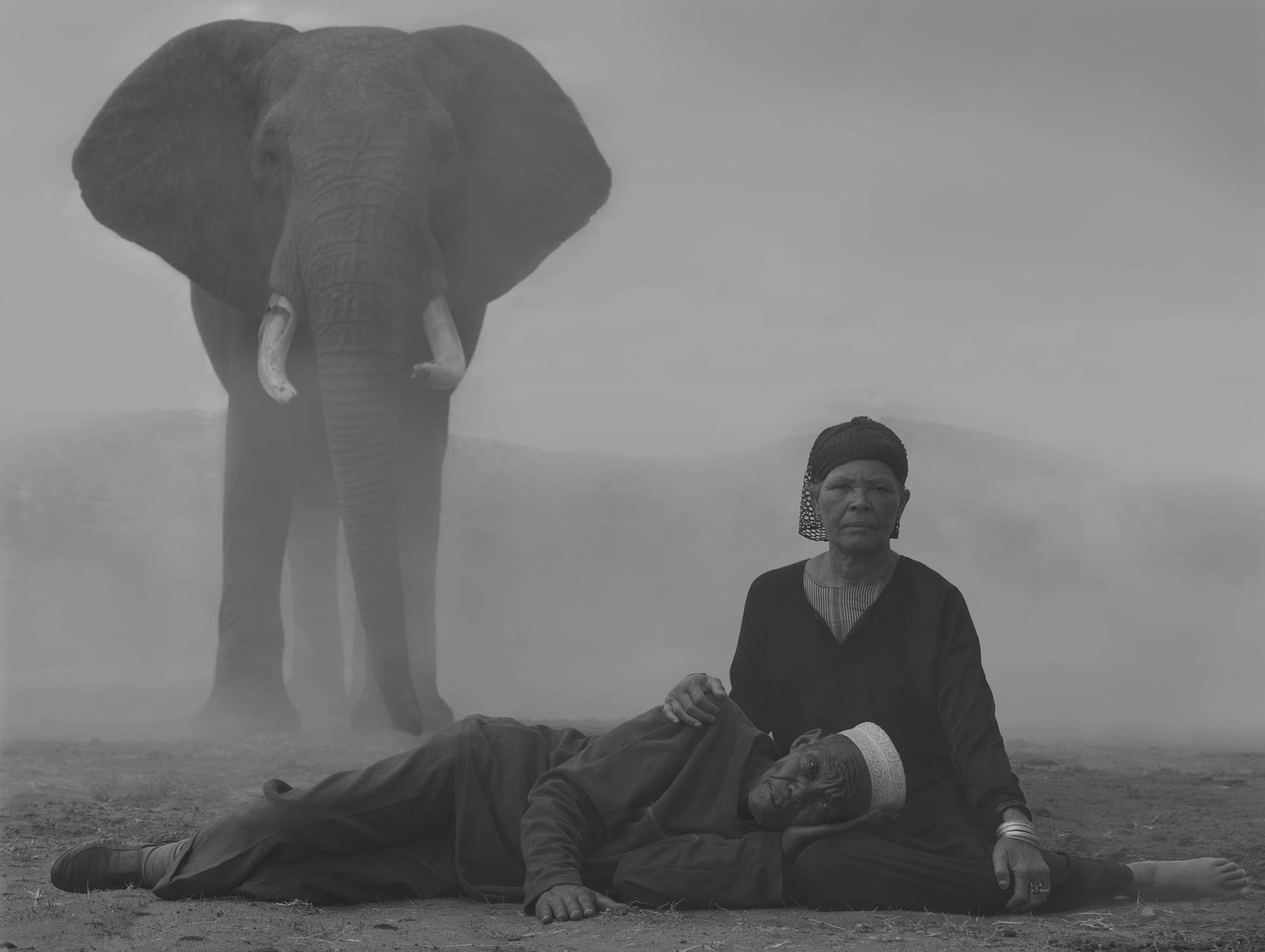 Kenya photograph Nick Brandt couple in front of elephant contemporary photography buy here Gilman Contemporary Sun Valley art gallery