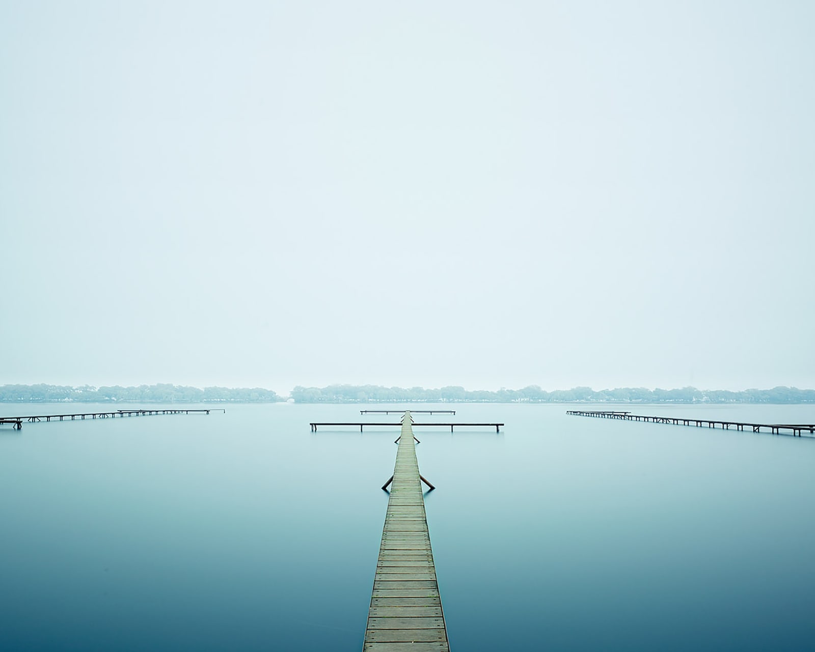 photograph serene dock in water
