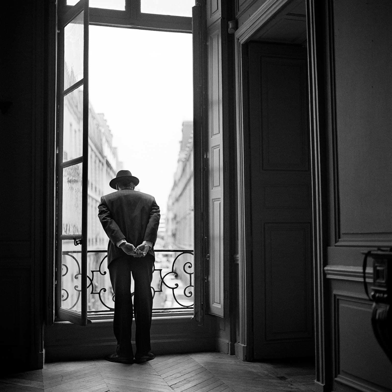 Rodney Smith photographs Man Looking over Balcony Paris buy here Gilman Contemporary Sun Valley art gallery