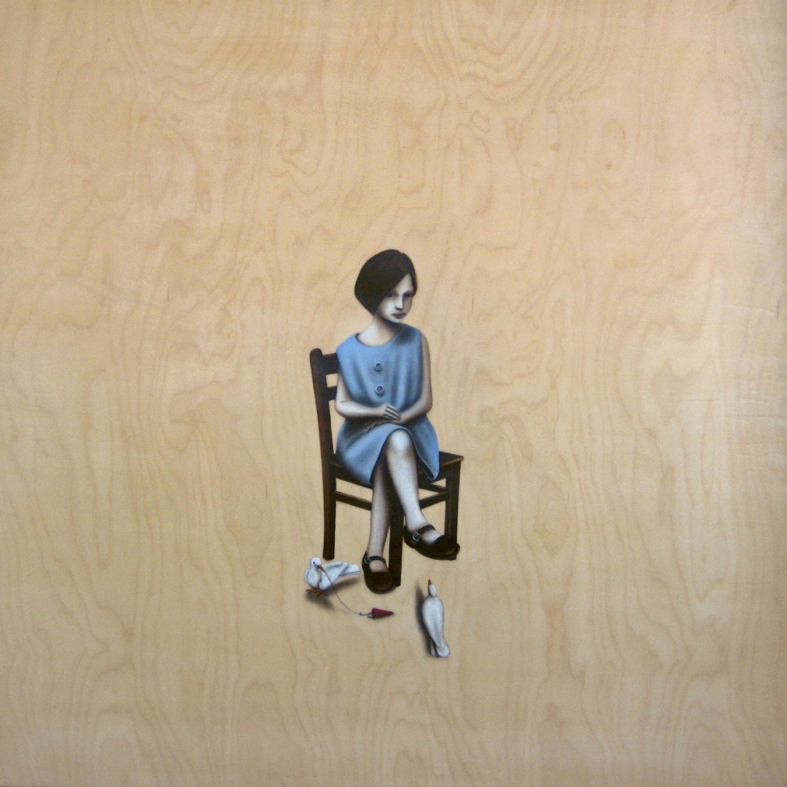 a patient girl sits on a chair with two pigeons on the ground doing weird things