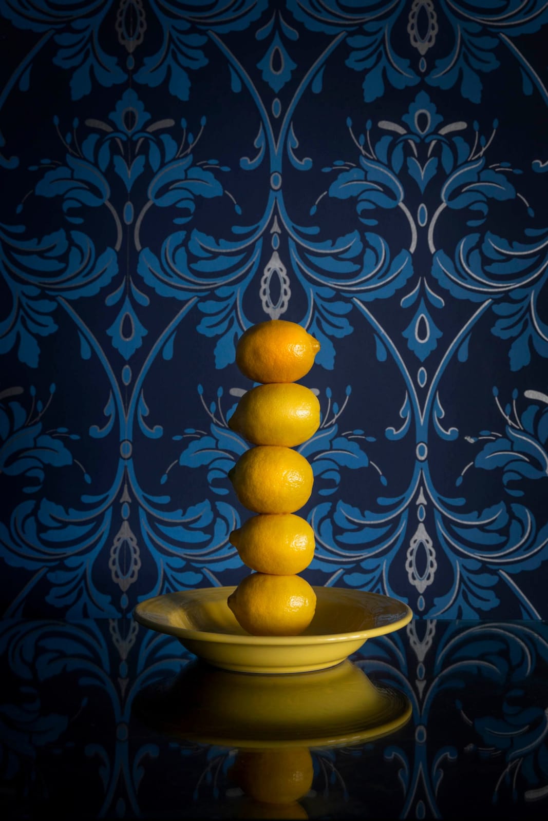 tower of lemons in yellow bowl by jp terlizzi