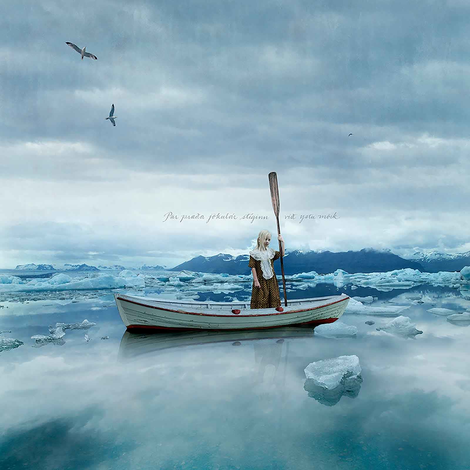 Tom Chambers photography blonde child in boat with an oar buy original here Gilman Contemporary Sun Valley art gallery Idaho