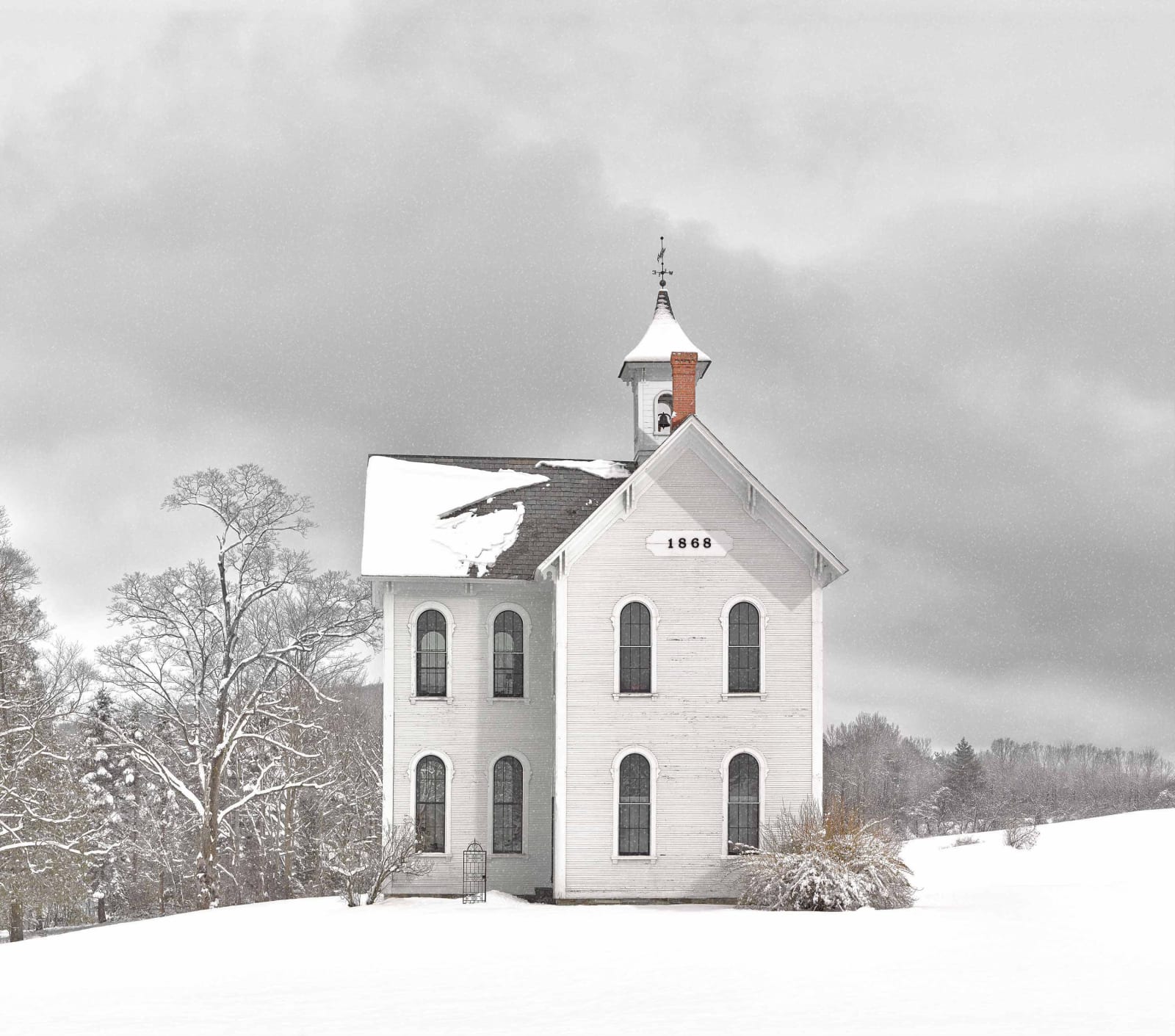 Jim Westphalen photograph old schoolhouse white with trees and snow view at Gilman Contemporary