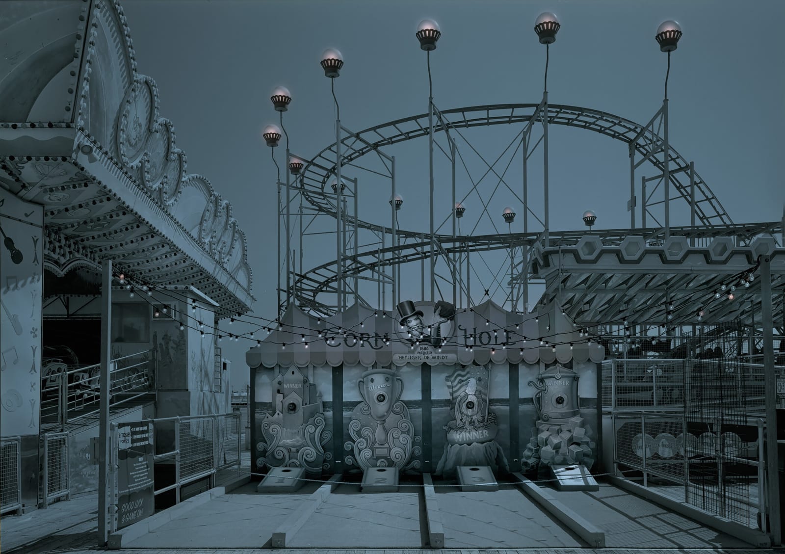 blue tone photograph of abandoned park rides coney island Michael massaia
