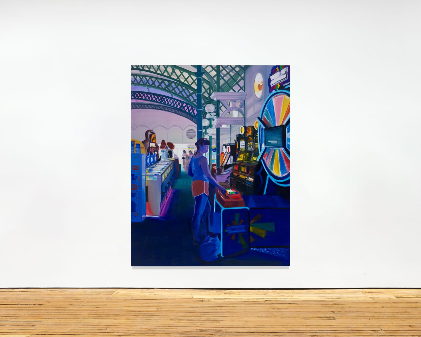 installation view of a large oil painting depicting a woman at a casino playing a wheel of fortune game