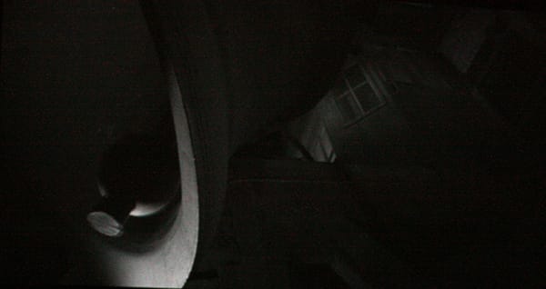 An inkjet print depicting a large, shadowy bell.