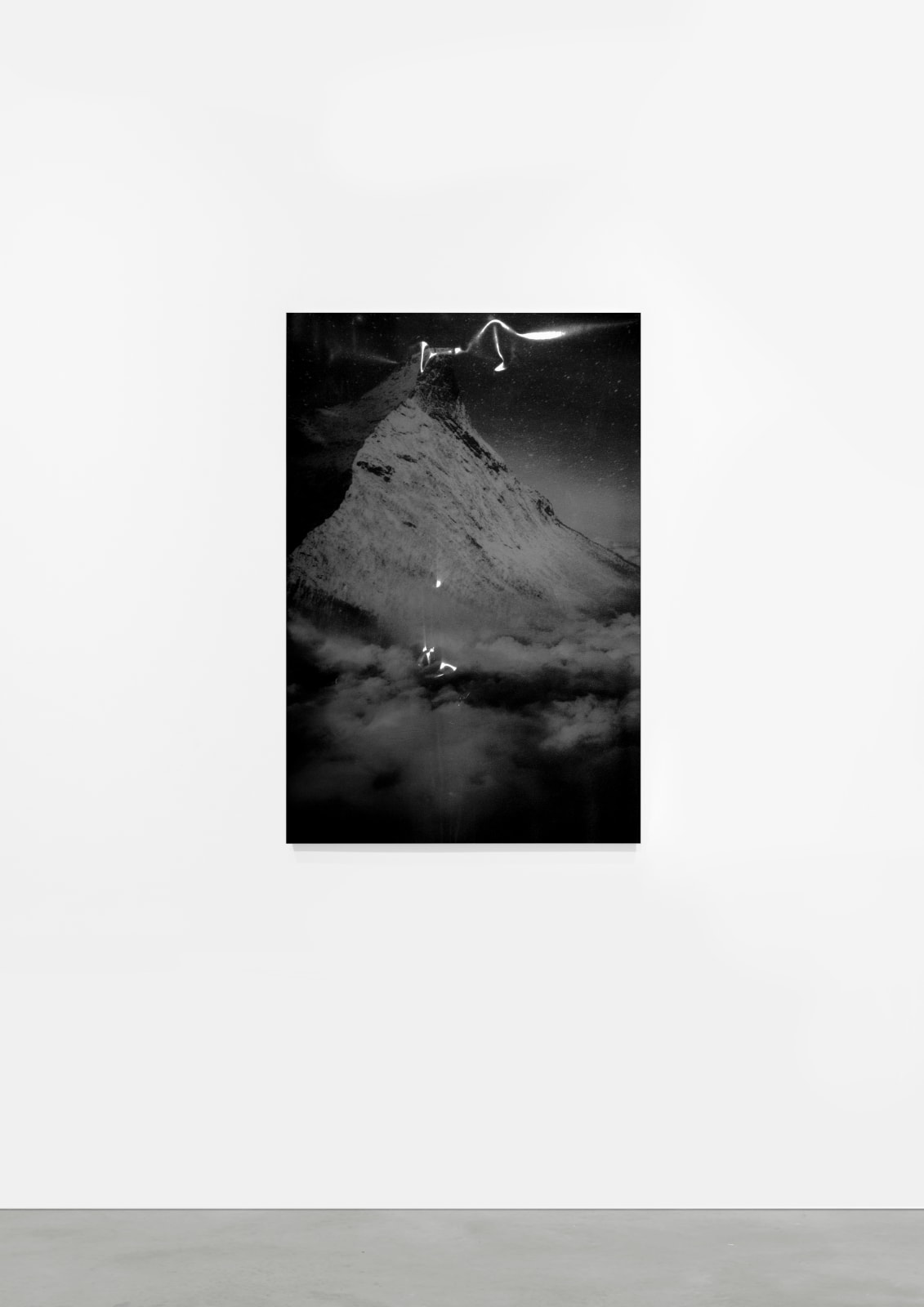 A black and white inkjet print of an abstract, unidentifiable scene.
