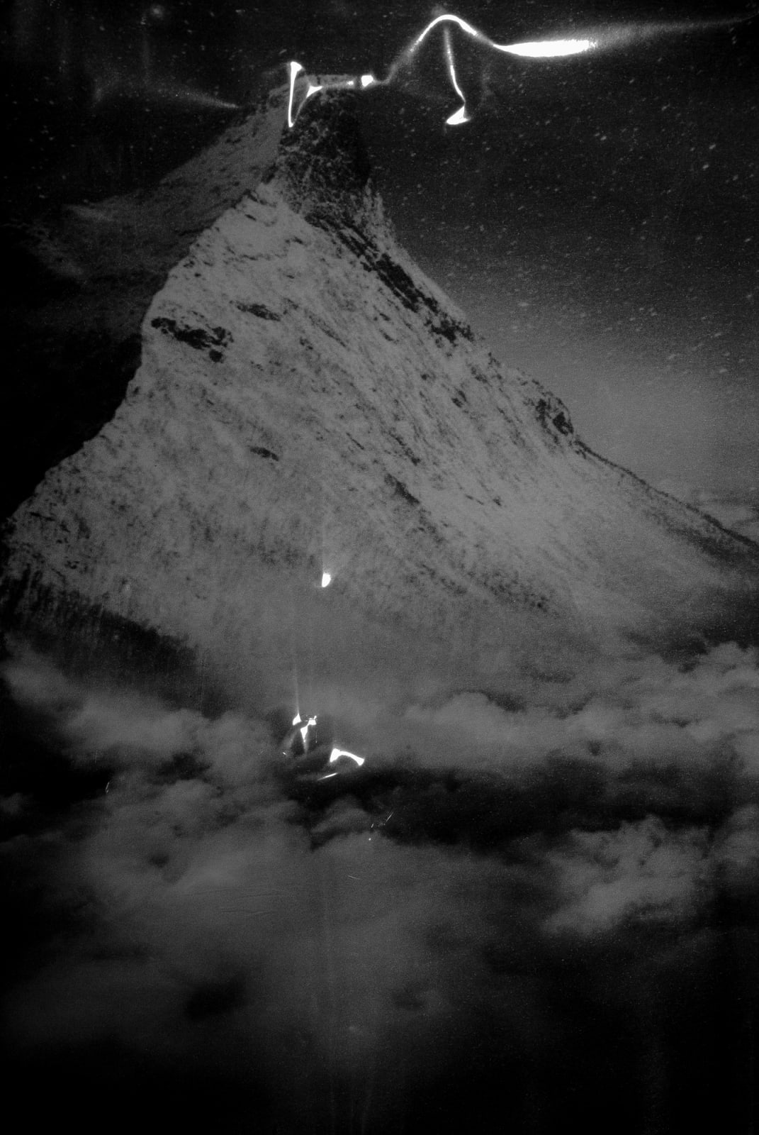 A black and white inkjet print of an abstract, unidentifiable scene.