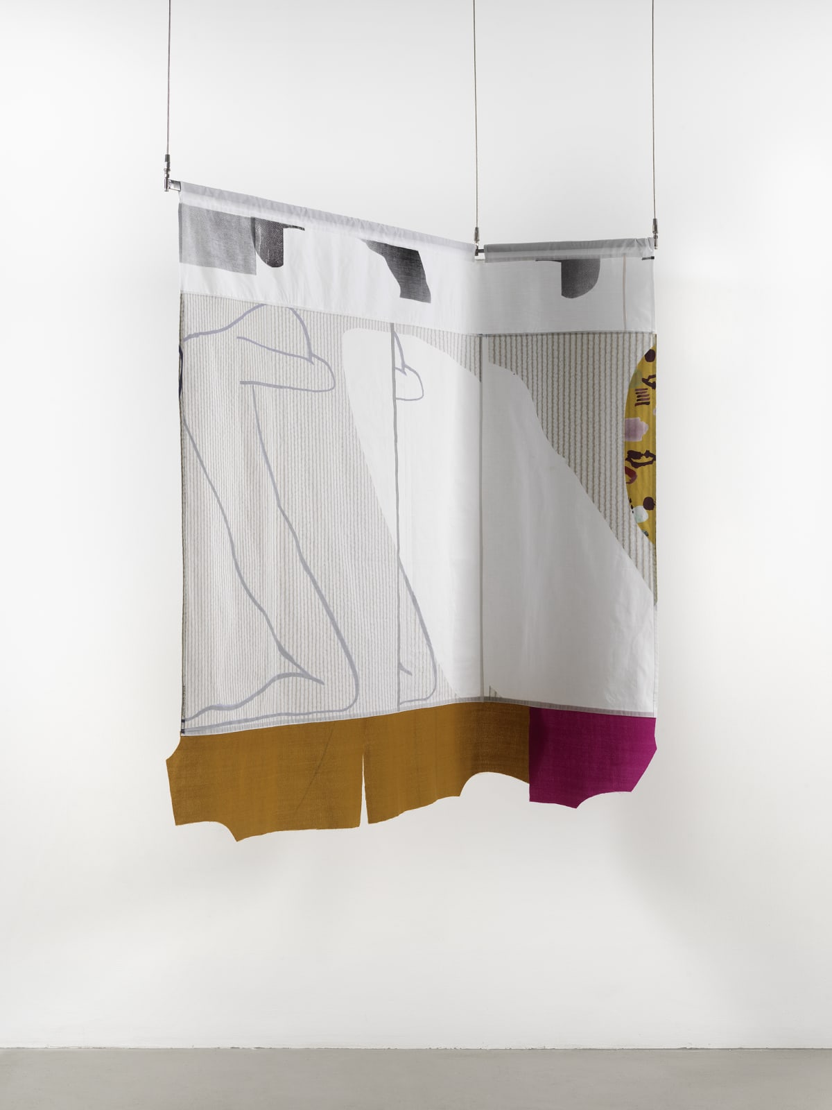 A medium sized textile hanging from the ceiling against a white wall, with an outline of a figure on the right side of the fabric.