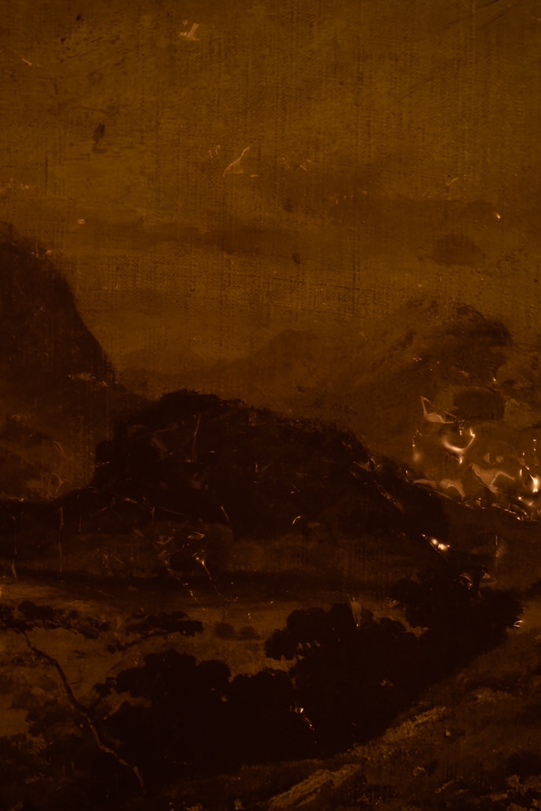 An inkjet print of a shadowy mountainous landscape.