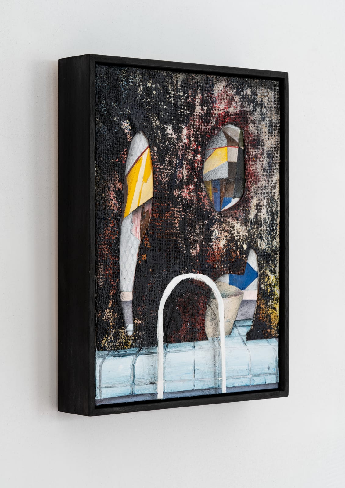 slanted angle of a multi media painting depicting surreal geometric figures along the side of a pool