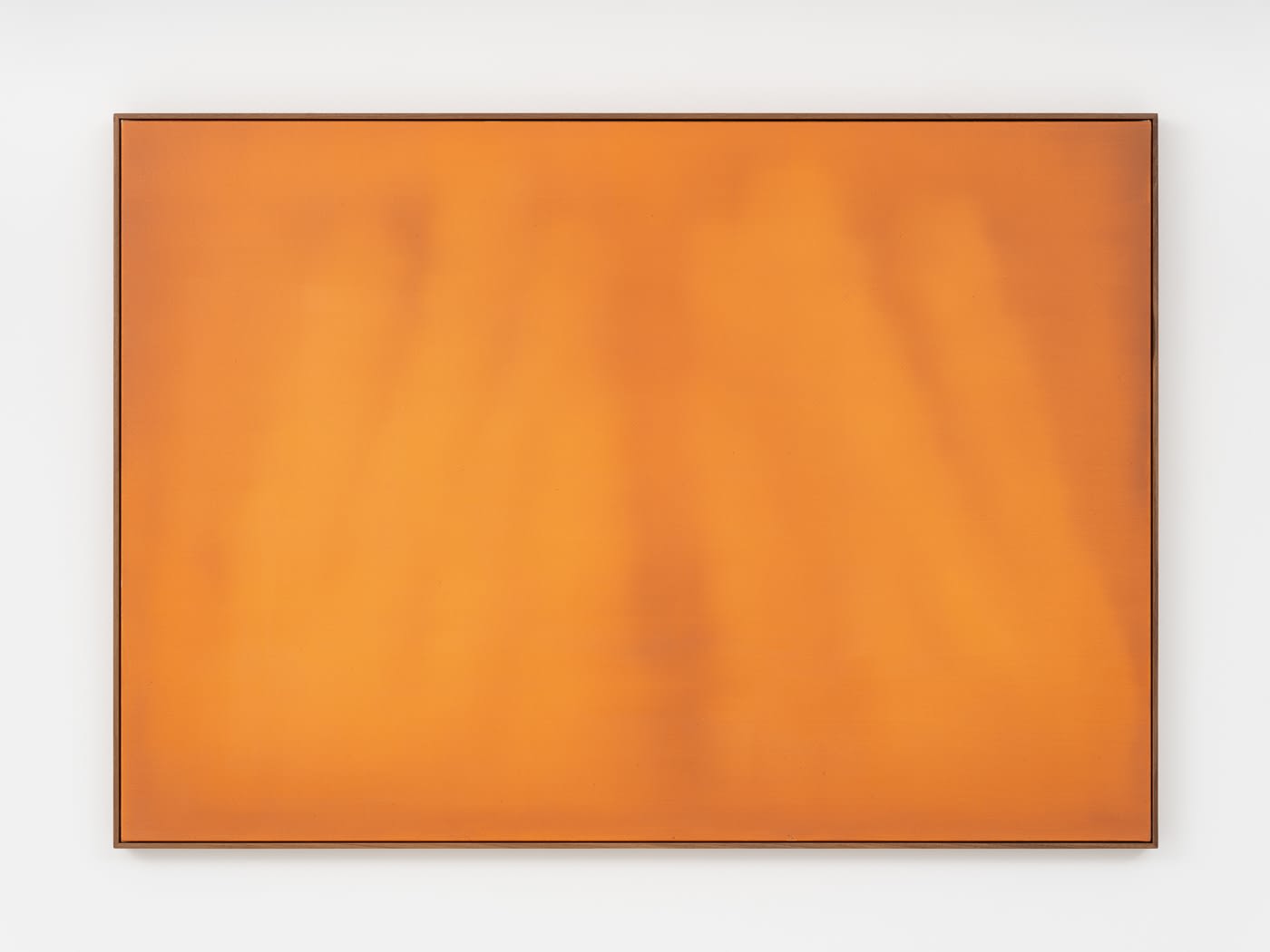 The work contains various hues of deep orange, with the darkest pointing being a soft linear shape running through the center of the canvas.