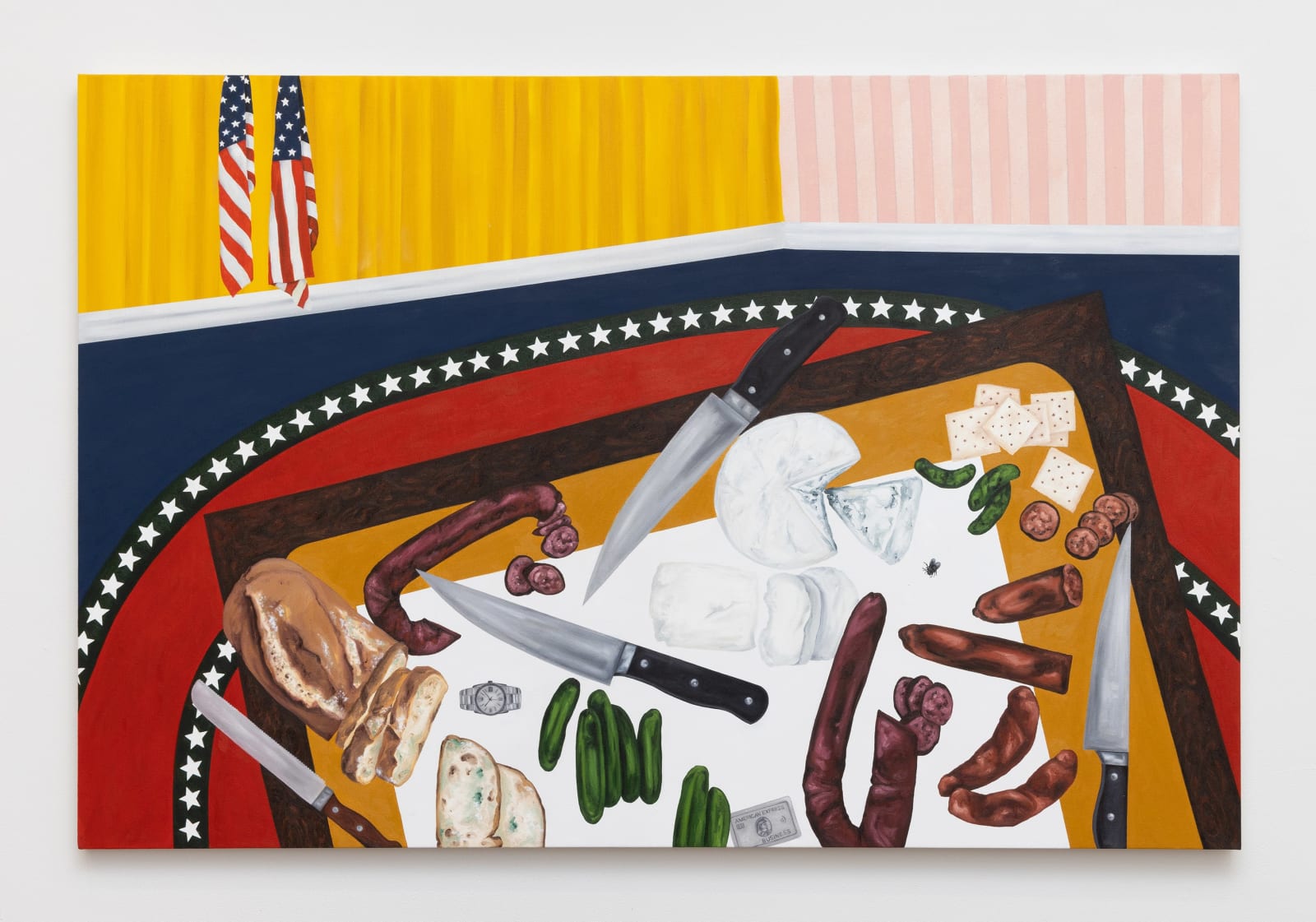 Painting of a charcuterie board tilted at an angle, filled with cheese, moldy bread, crackers, pickles, salami, four knives, a credit card, and a Rolex watch. Two American flags hung in the corner of the room which has navy floor with white starred outline red rug, with the pink striped and yellow striped wallpaper from right to left.