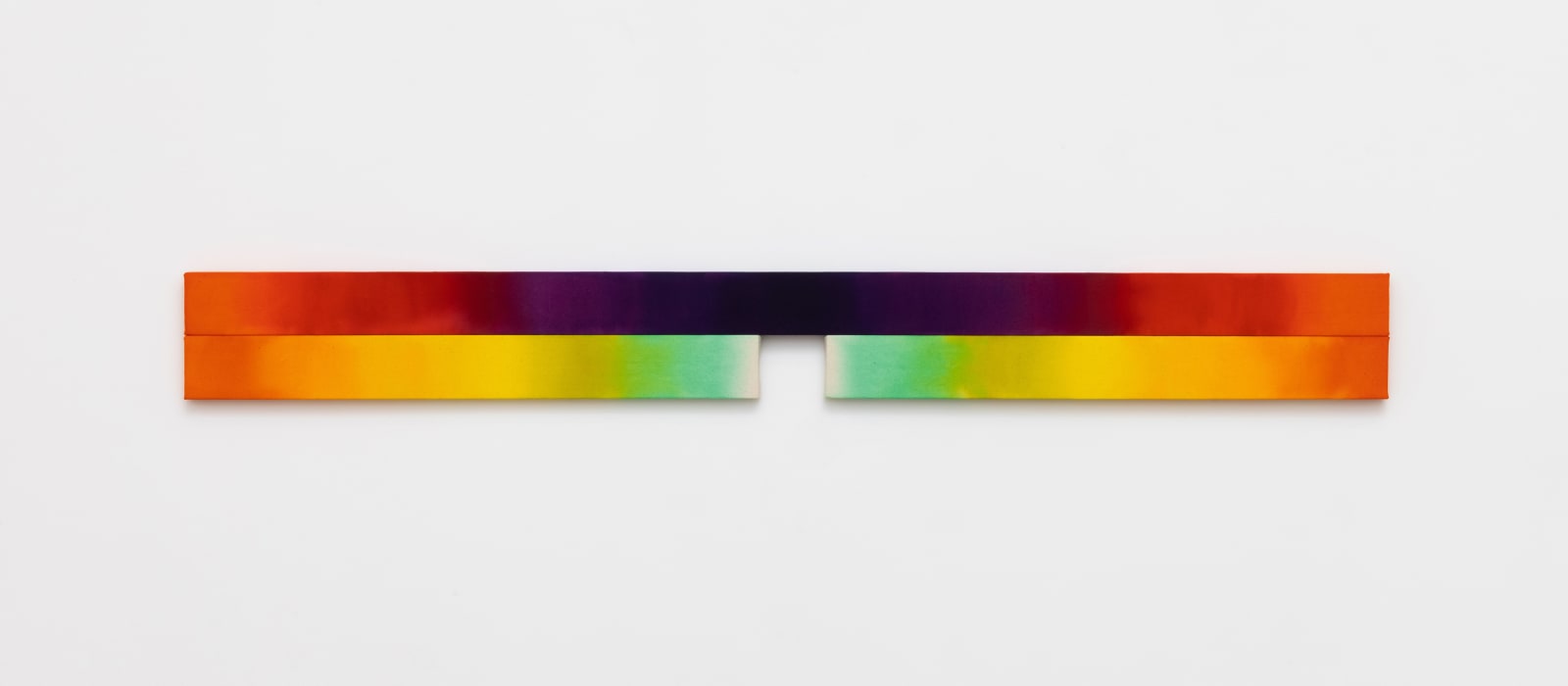 Horizontal shaped canvas painting stretched on three wooden bars varying in length and colors of the rainbow. 