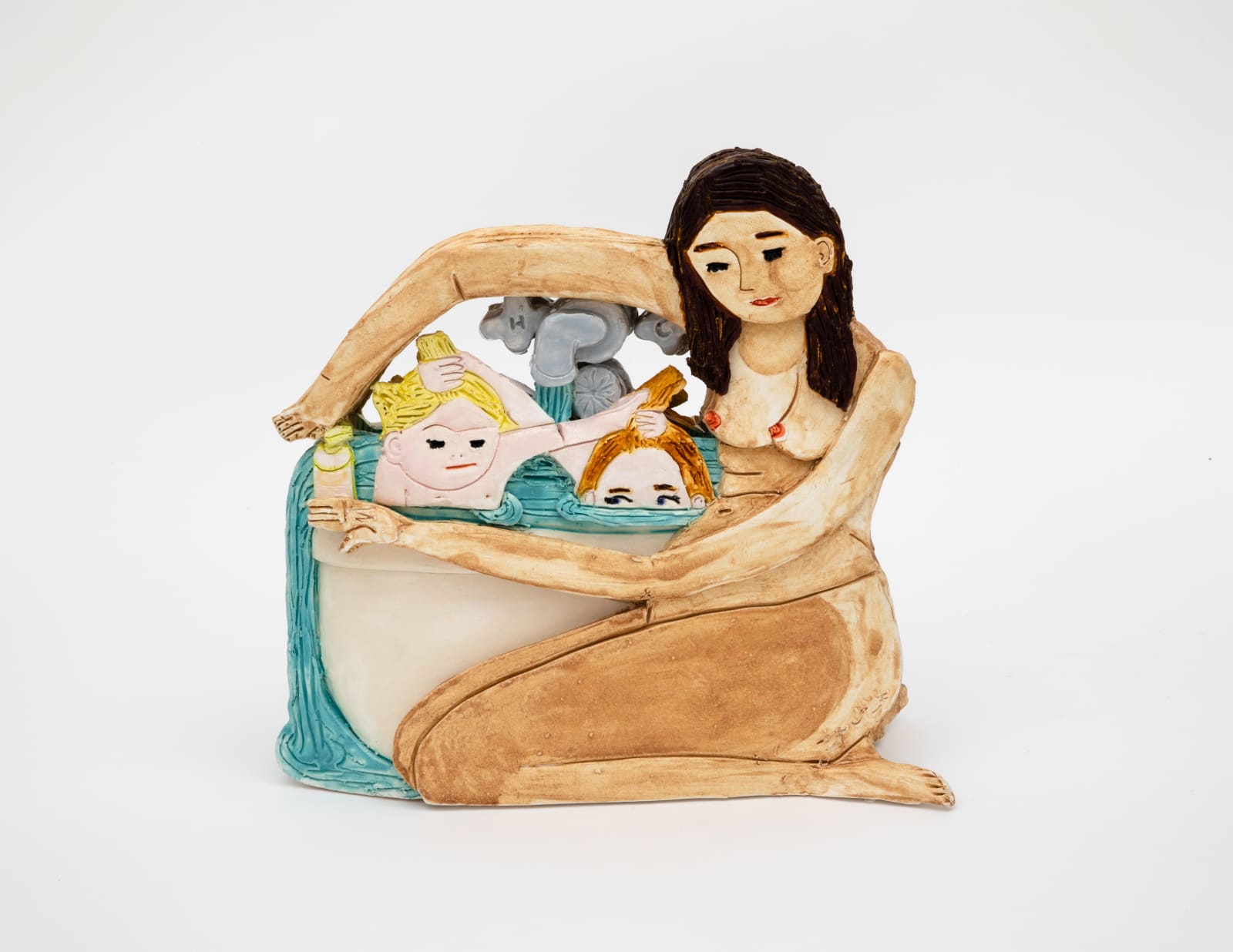 Ceramic sculpture of the artist naked and bathing her two children in a bathtub 