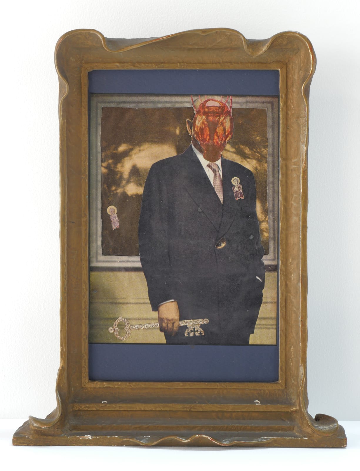 Untitled (Suited Man Holding Key), framed