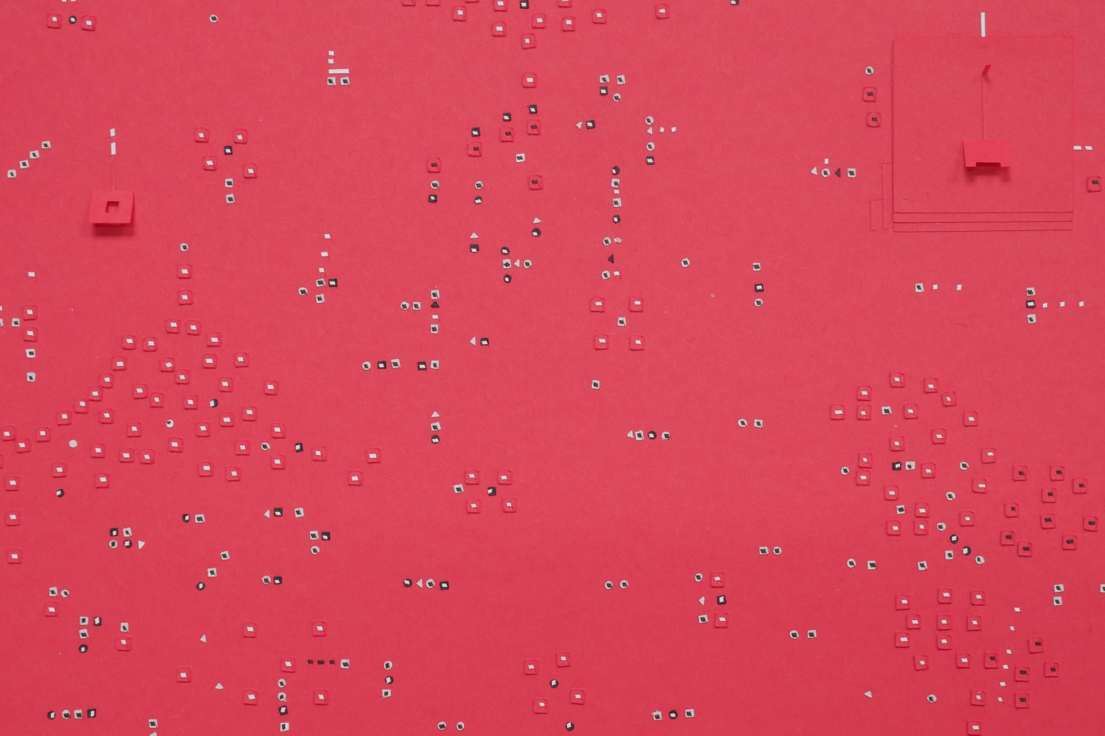 Detail; white, black, and red 1D and 3D cutouts and flaps on a red background.