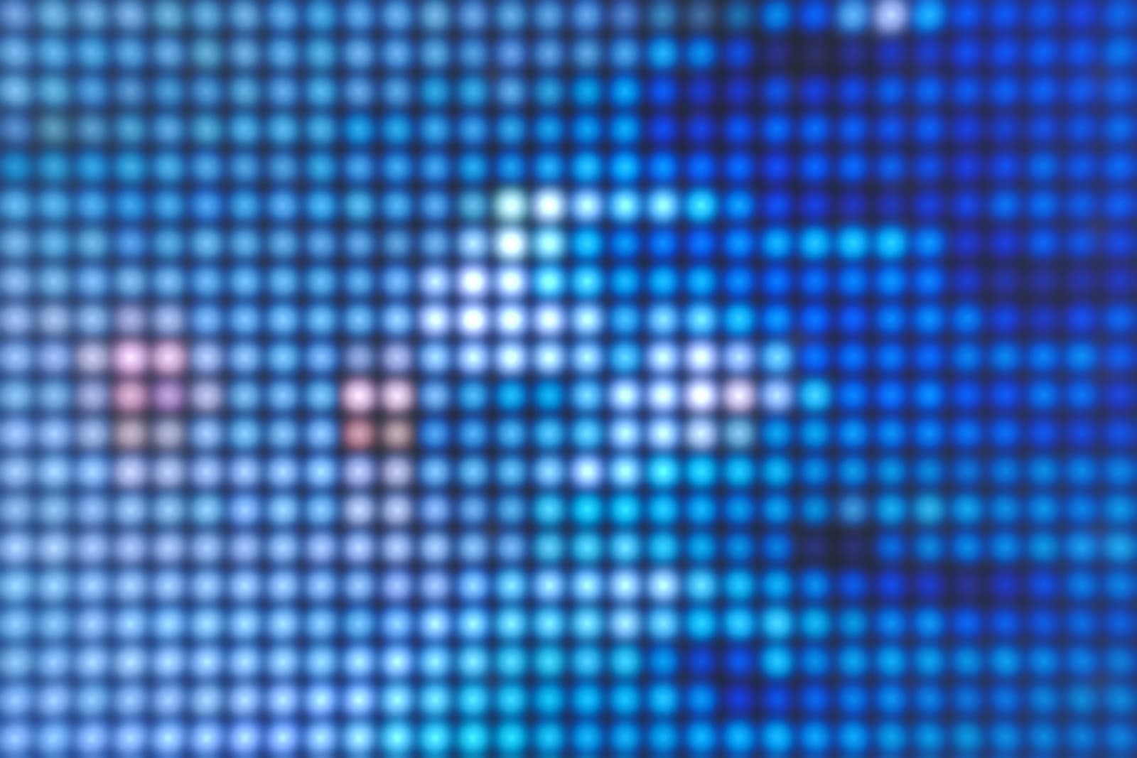 Still close up image of the LEDs though the Plexiglass that make up several swimmers the ocean and many waves in Southern California