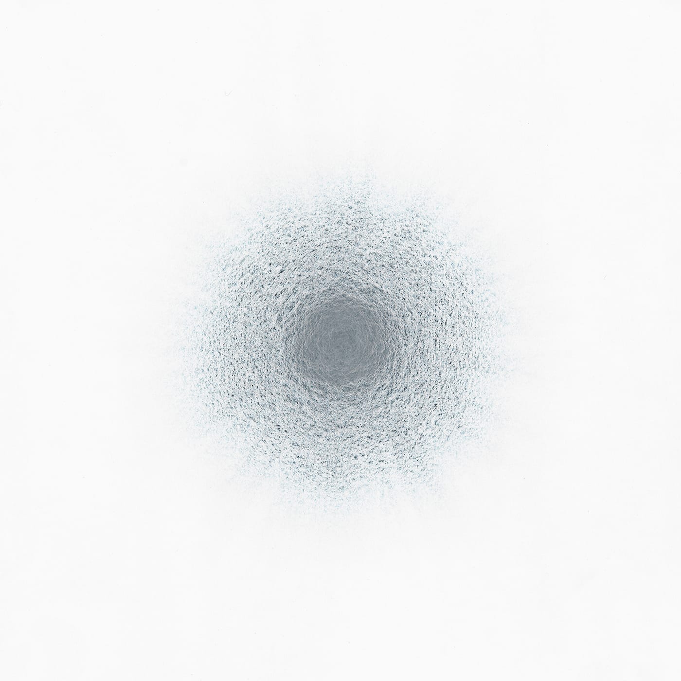 Loose blue and black marks encircle a dense gray mass. The marks diffuse as they expand from the center, becoming lighter and more sparse the farther they are from the gray mass.