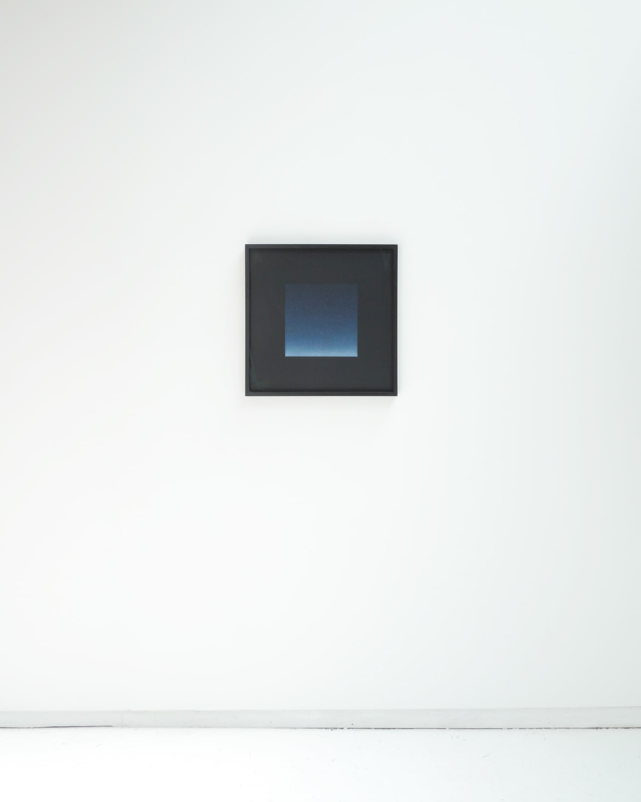 Framed Floating Phthalo Blue Square hangs on a white wall
