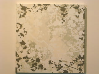 Several layers of multi-colored acrylic paint overlap to display multiple vegetal patterns
