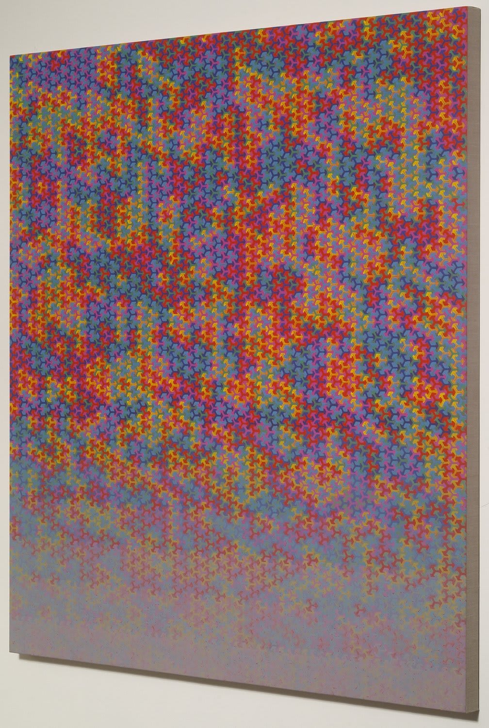 Multi-colored asterisk shaped forms morphing against each other which then fade into a gray towards the bottom of the piece
