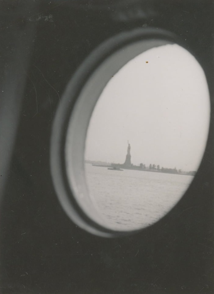 Ilse Bing photograph of the Statue of Liberty through a round window