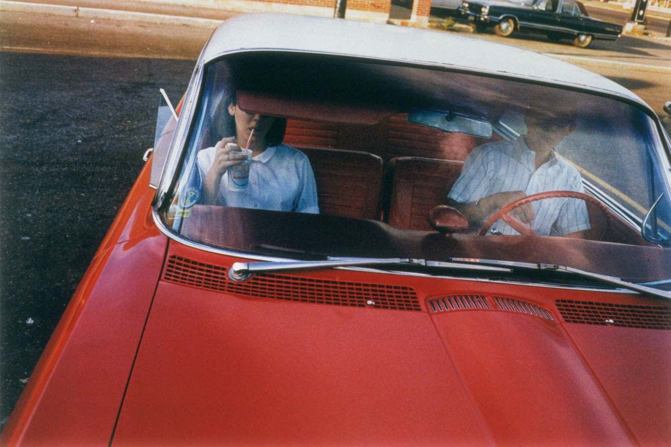 William Eggleston, Untitled (Couple in Red Car at Drive-In Restaurant), Memphis, TN [From Dust Bells 2], 1965-68