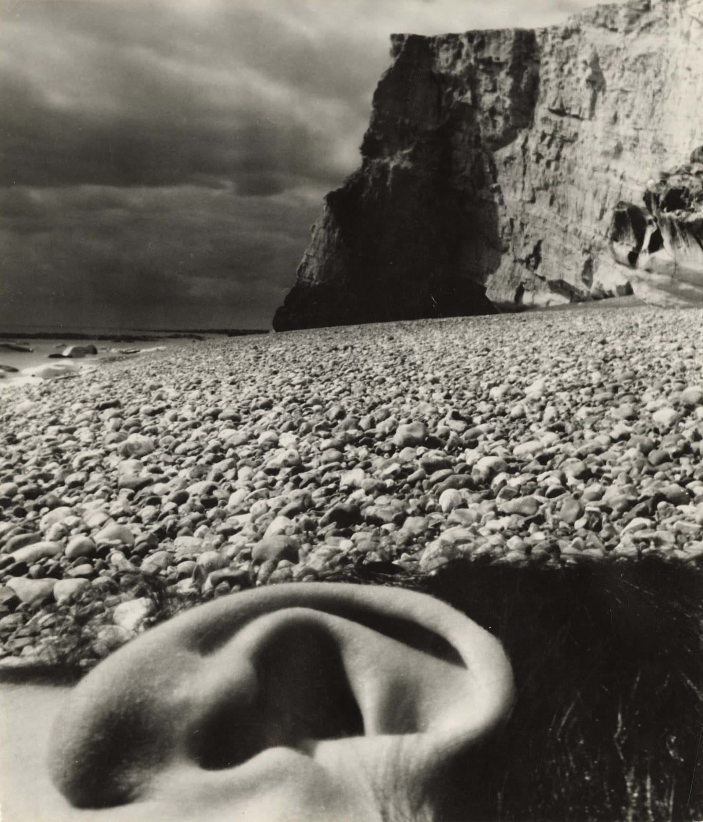 abstracted view of ear on beach at East Sussex Coast by Bill Brandt