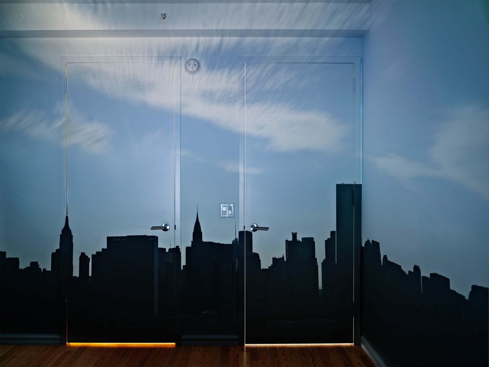 Abelardo Morell Camera Obscura Late Afternoon View of the East Side of Midtown Manhattan dark skyline silhouette projected in empty room with two doors