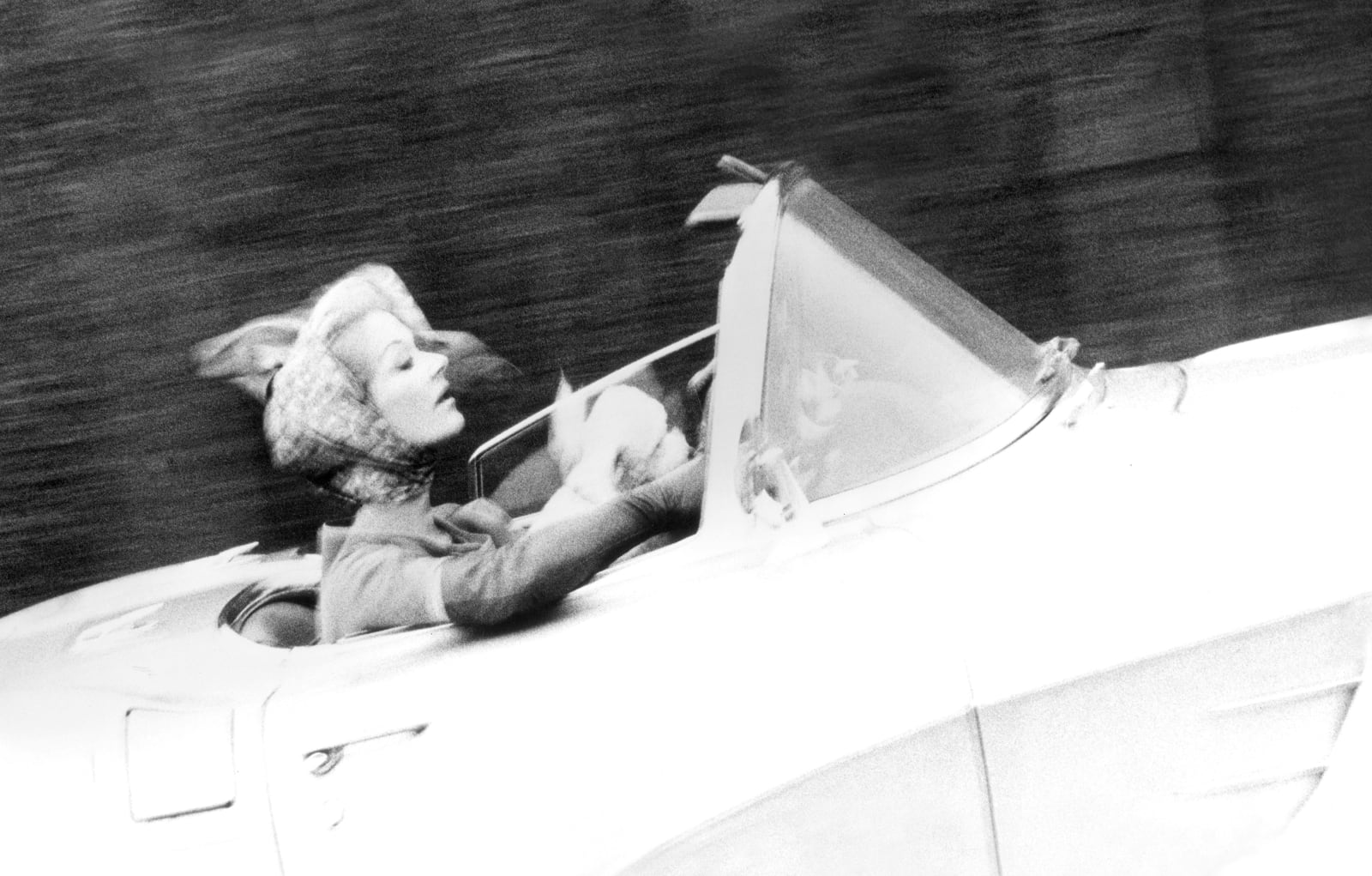 Lillian Bassman photograph of Lisa Fonssagrives driving convertible