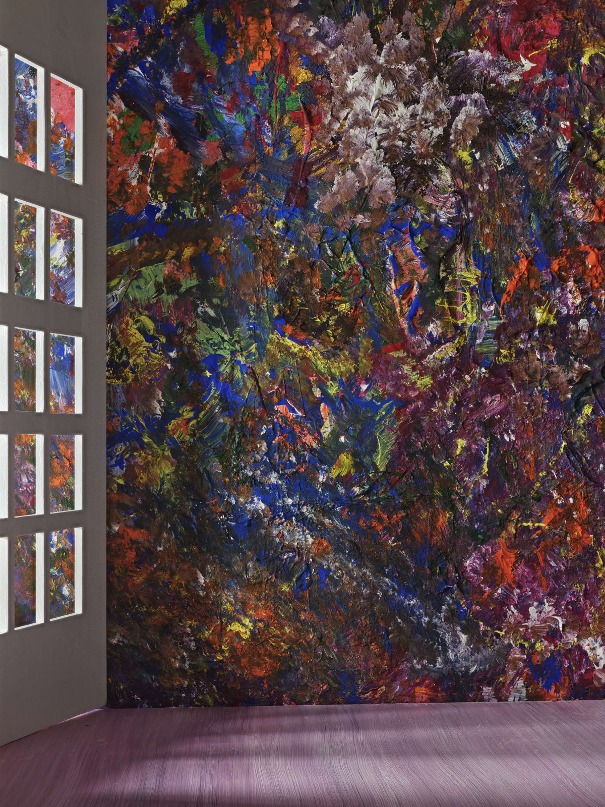 multi-colored painted wall next to window panels