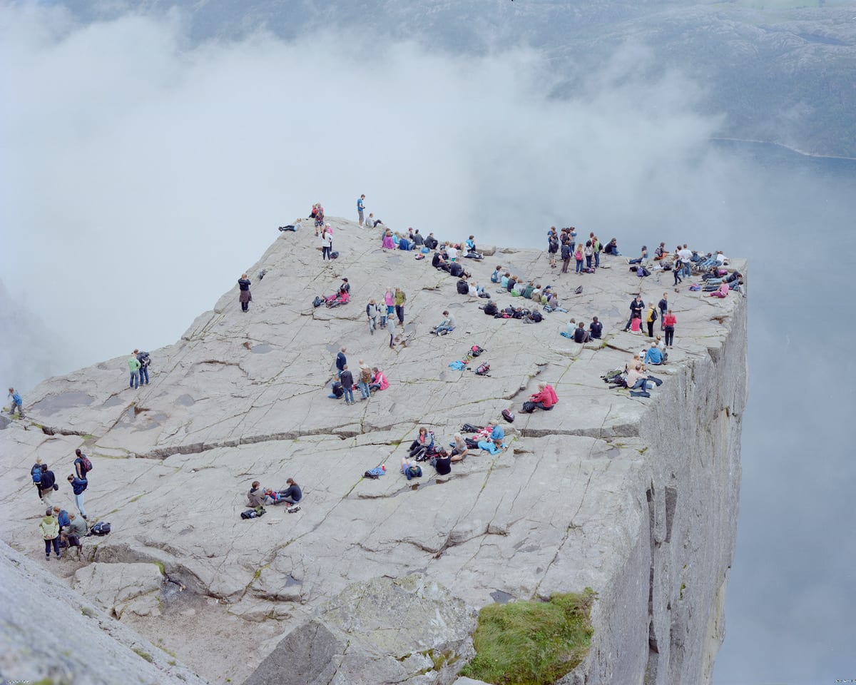 Hikers on clif at Preikestolen (Pulpit Rock), Norway by Massimo Vitali